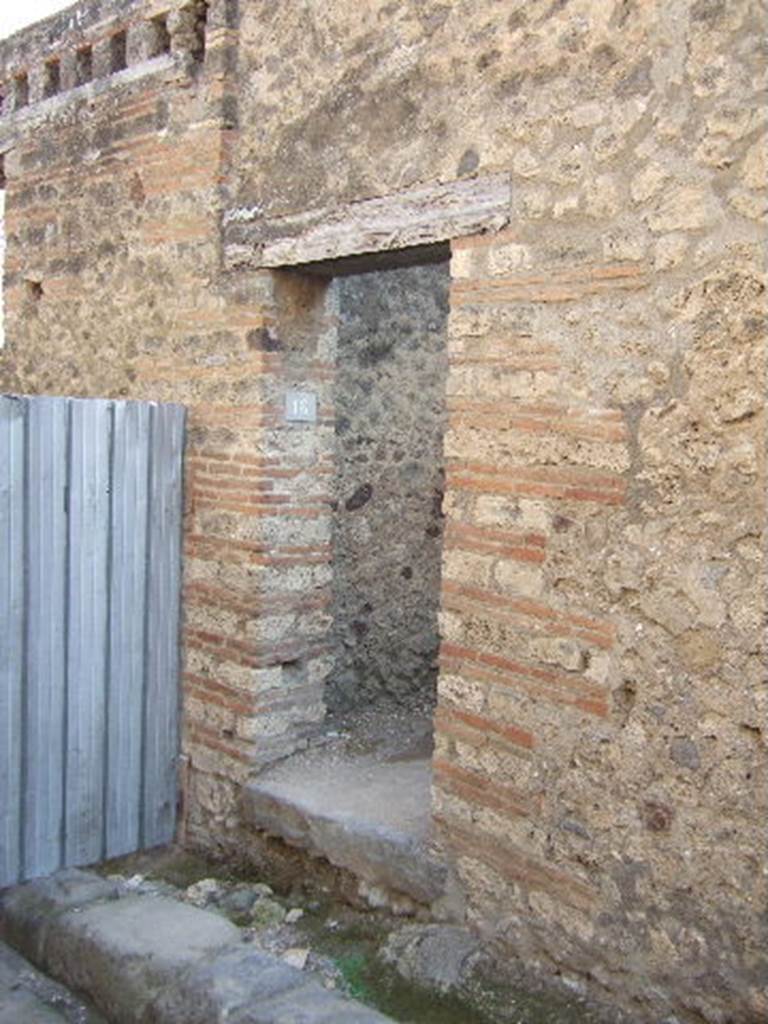 VII.12.16 Pompeii. September 2005. Looking south to entrance doorway. According to Della Corte, found to the right of the doorway were the words � Scribit Paris, idem rogat    [CIL IV 821]
He thought the entrance doorway led to steps to a hospitium on the upper floor, and that the host was named Paris.  See Della Corte, M., 1965.  Case ed Abitanti di Pompei. Napoli: Fausto Fiorentino. (p.202)
According to Epigraphik-Datenbank Clauss/Slaby (See www.manfredclauss.de), CIL IV 821 read -
A(ulum) Suettium Certum aed(ilem) o(ro) v(os) f(aciatis)
scrib(s)it Paris idem rogat
aetatis d(ignum) [r(ei) p(ublicae)] Iarin[    [CIL IV 821]


