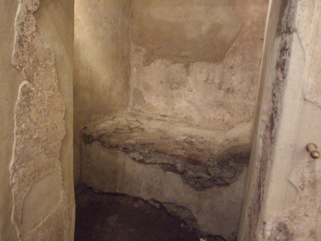 VII.12.18 Pompeii. December 2006. Doorway into prostitute’s room with stone bed.