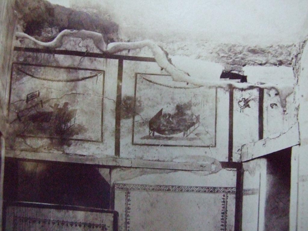 VII.12.18 Pompeii. Old undated photo showing same frieze on upper wall at west end.
Courtesy of the Society of Antiquaries (Fox Collection).