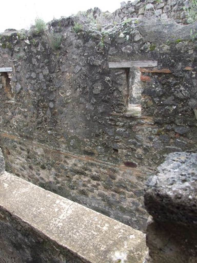VII.12.20  Pompeii.  March 2009.  Looking out of window at small windows opposite in upper wall of VII.11.11.