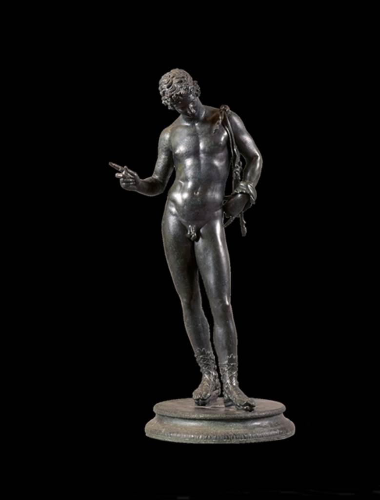 VII.12.21.17 Pompeii.  June 1862.  Bronze statue found in the small room near the entrance at VII.12.17.  Fiorelli identified it on excavation as possibly a statue of Narcissus.  See Pappalardo, U., 2001. La Descrizione di Pompei per Giuseppe Fiorelli (1875). Napoli: Massa Editore. (p.112).  Mau identifies it as a statue of Dionysus and it is now displayed as this.  See Mau, A., 1907, translated by Kelsey F. W. Pompeii: Its Life and Art. New York: Macmillan. (p.452).  Now in Naples Archaeological Museum.  Inventory number 5003.