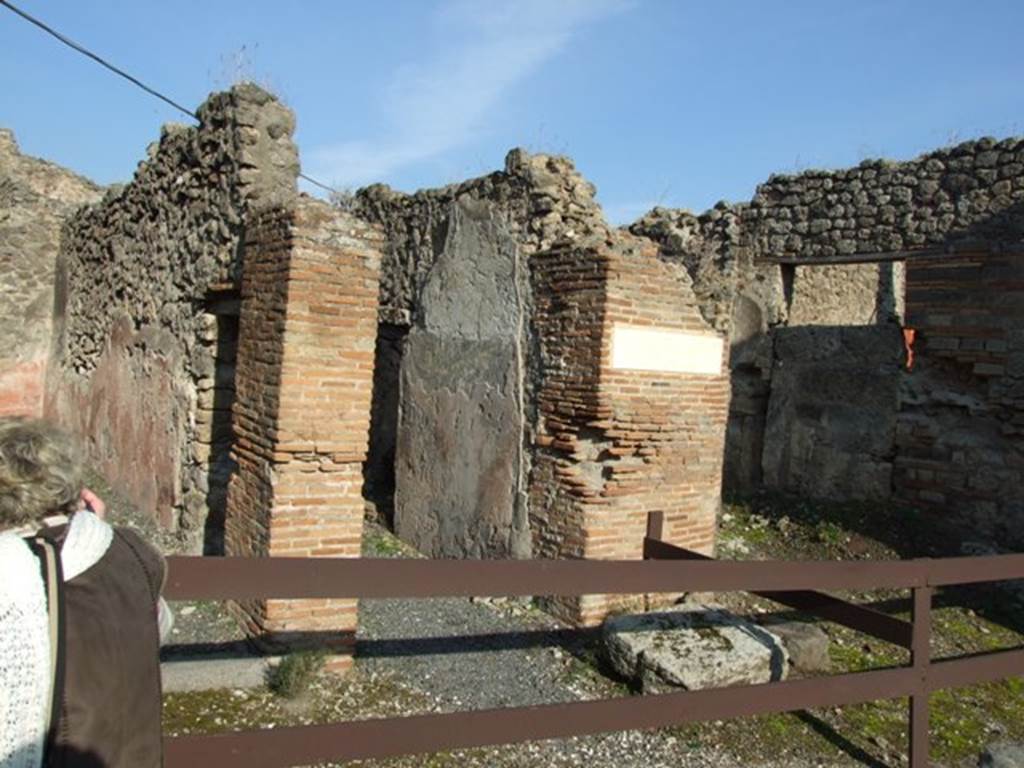 VII.12.26 Pompeii. December 2007. Entrance doorway. According to Della Corte, this house was assigned to L. Cornelius Diadumenus and to his freedman Communis, because of the seal/signet found here.
It read -
L. Corneli Diadumeni Com(munis) l(ibertus)   [CIL X 8058, 24]
The house was not a big house, but it was noted for its painted walls.
See Della Corte, M., 1965.  Case ed Abitanti di Pompei. Napoli: Fausto Fiorentino. (p.202 no. S31)
