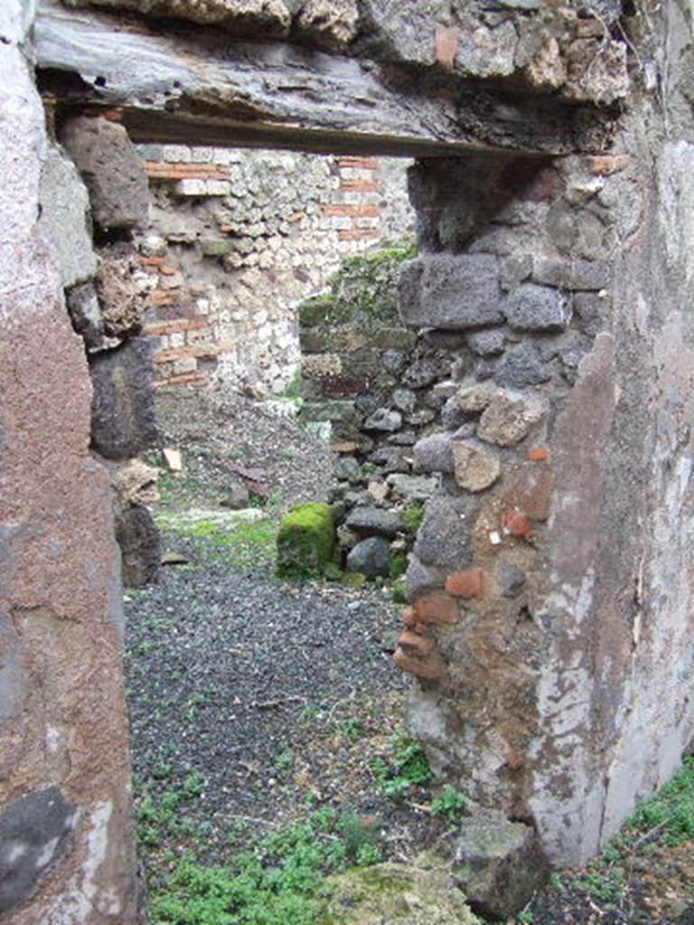 VII.12.26 Pompeii. December 2005. Looking east through doorway into kitchen.