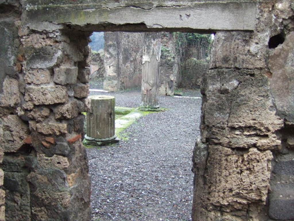 VII.13.8 Pompeii. December 2005. Room in north-west corner of atrium. Looking south through doorway along west side of atrium. 
