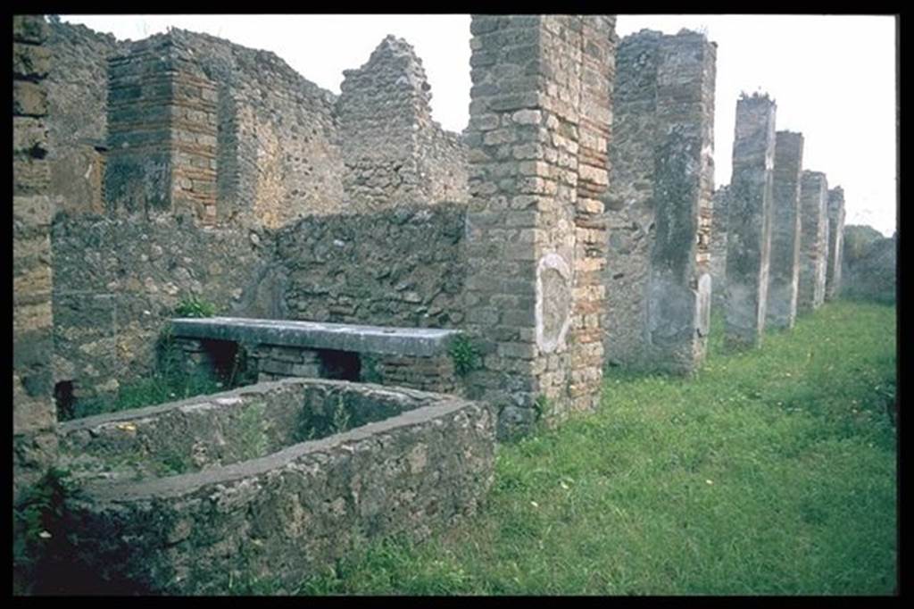 VII.14.18 Pompeii.   Looking east from entrance.  North side, with basin and bench.  Photographed 1970-79 by G�nther Einhorn, picture courtesy of his son Ralf Einhorn.
