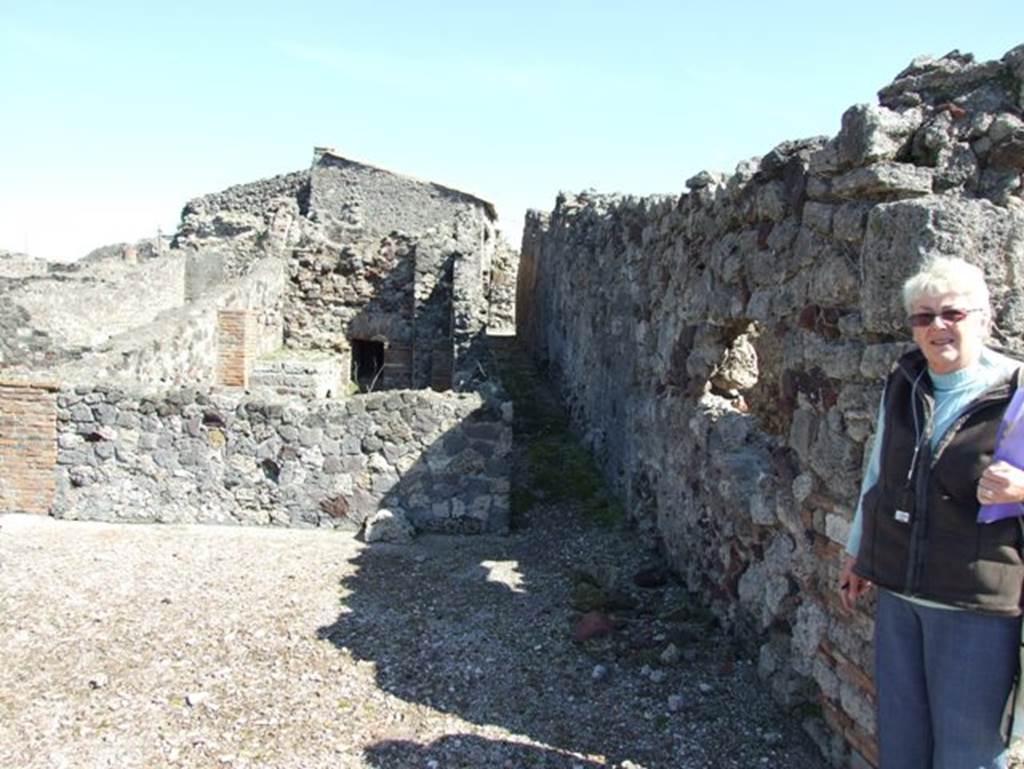 VII.15.2 Pompeii.  March 2009. Looking east to corridor leading to kitchen and baths area.