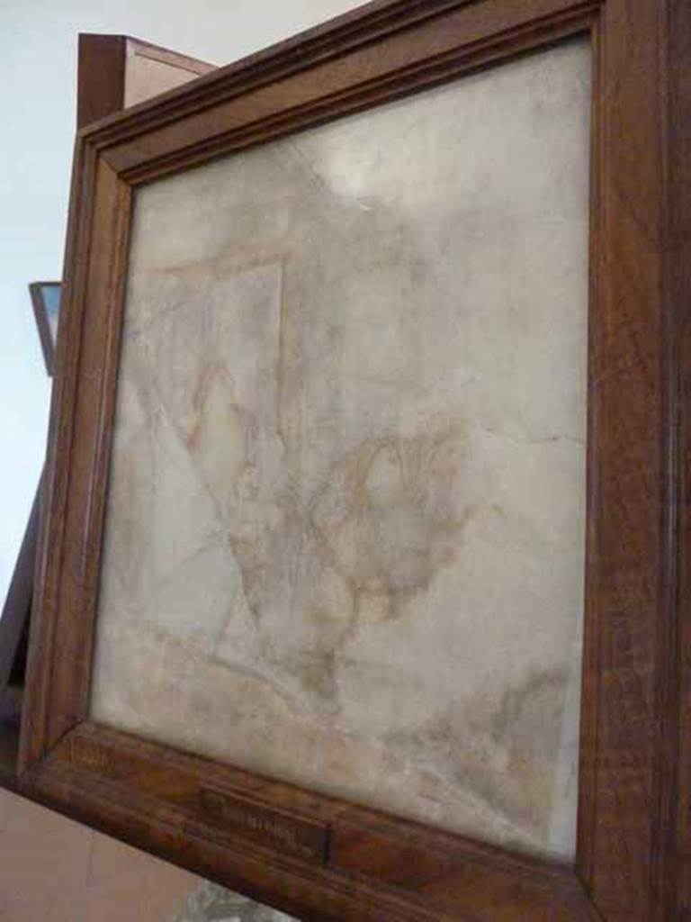 VII.15.2 Pompeii. May 2010. Sepia coloured outlines on marble. Found in the room on the east side of the entrance, on 3rd February 1872. Now in the Naples Archaeological Museum. Inventory number 109370.