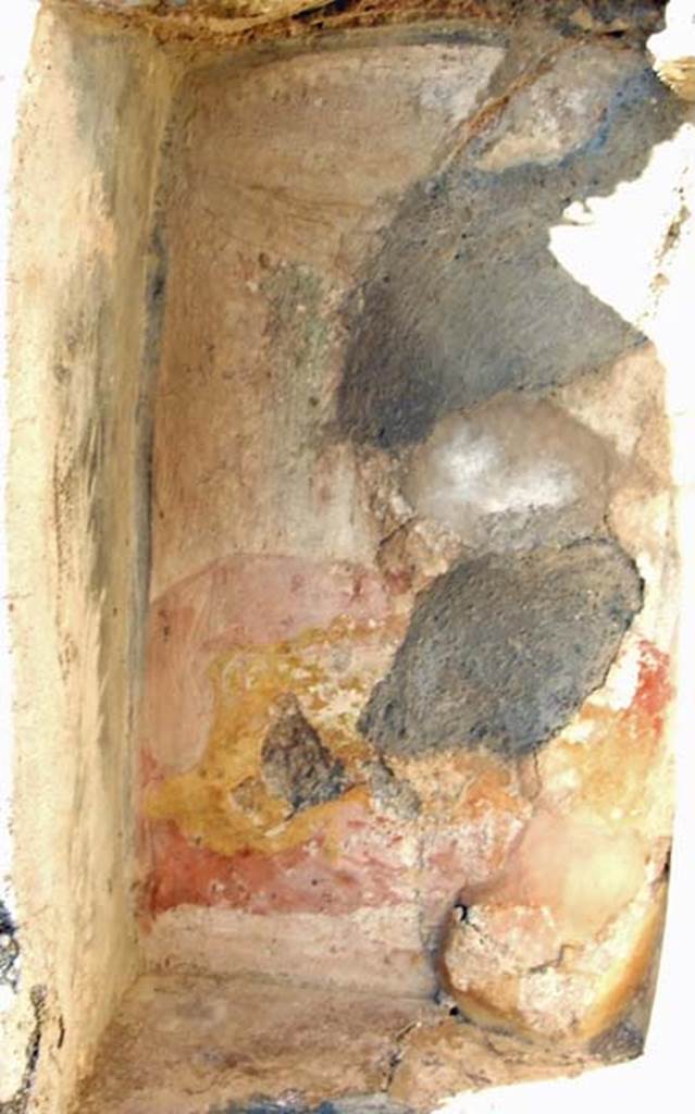 VII.15.5 Pompeii. December 2007. Detail of niche.
Boyce recorded a female figure reclining on a kline or couch, under an awning.
She was naked from the waist upwards and wearing a yellow robe from the waist down. 
In front was a three legged table on which were three jars.
According to Fiorelli this figure was Libera.
See Boyce G. K., 1937. Corpus of the Lararia of Pompeii. Rome: MAAR 14.  (p. 72, no.330, plate 12,3).
See Fiorelli G., 1875. Descrizione di Pompei. Napoli. (p. 310).
