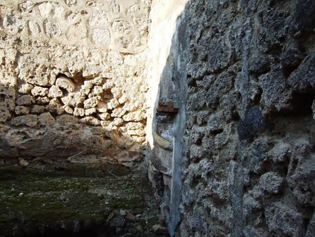 VII.15.13 Pompeii. December 2007. Lararium on east wall of kitchen area.