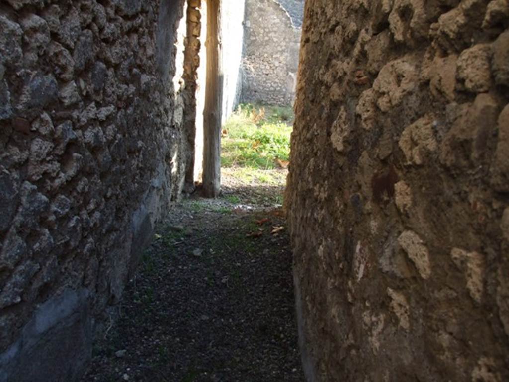 VII.15.13 Pompeii. December 2007. Corridor in kitchen area, looking south to atrium.