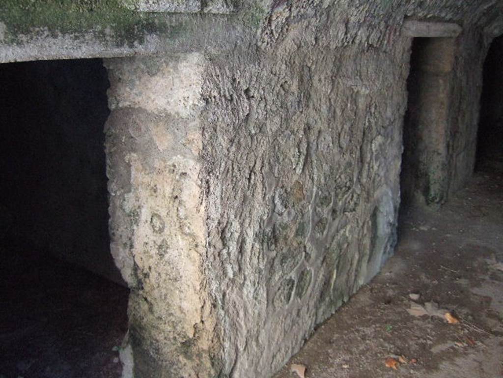 VII.15.16 Pompeii. September 2005. East side of corridor A, with doorways to rooms E and G, rooms without windows.