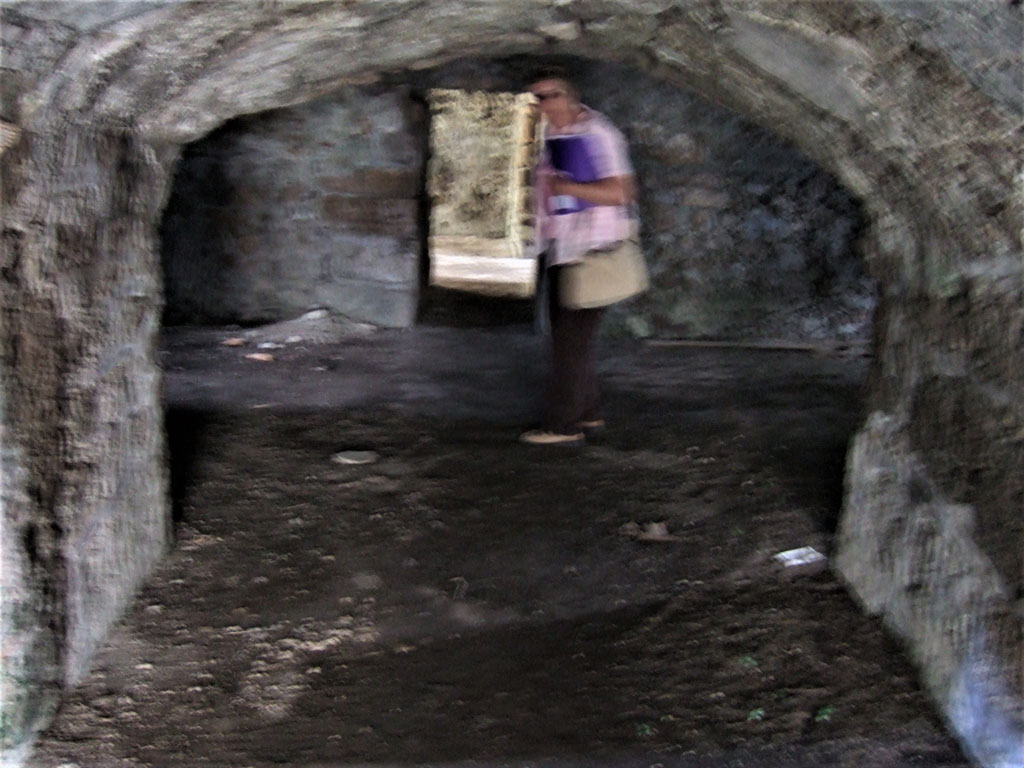 VII.15.16 Pompeii. May 2006. South end of corridor A, leading into open space I, on left, and H. on right. 
In the centre of the photo is the narrow entrance leading to rooms K, L, and other storerooms on south side.
