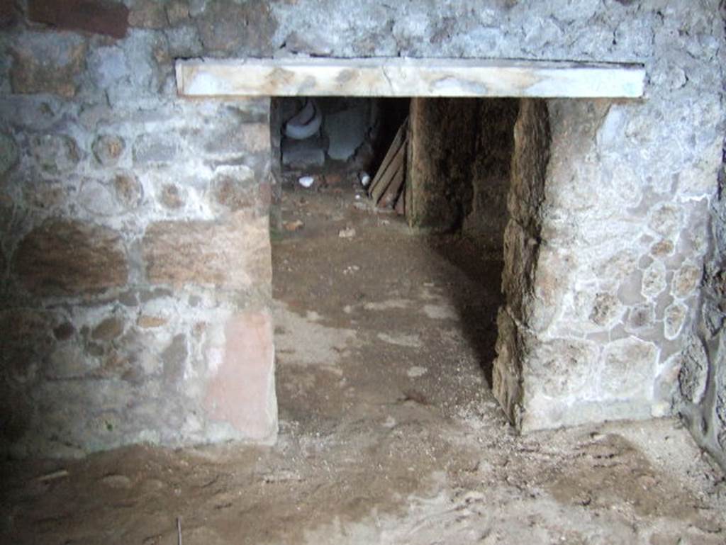 VII.15.16 Pompeii. May 2006. Granary.  Room F, looking towards doorway in east wall to corridor A, looking across to room G.
