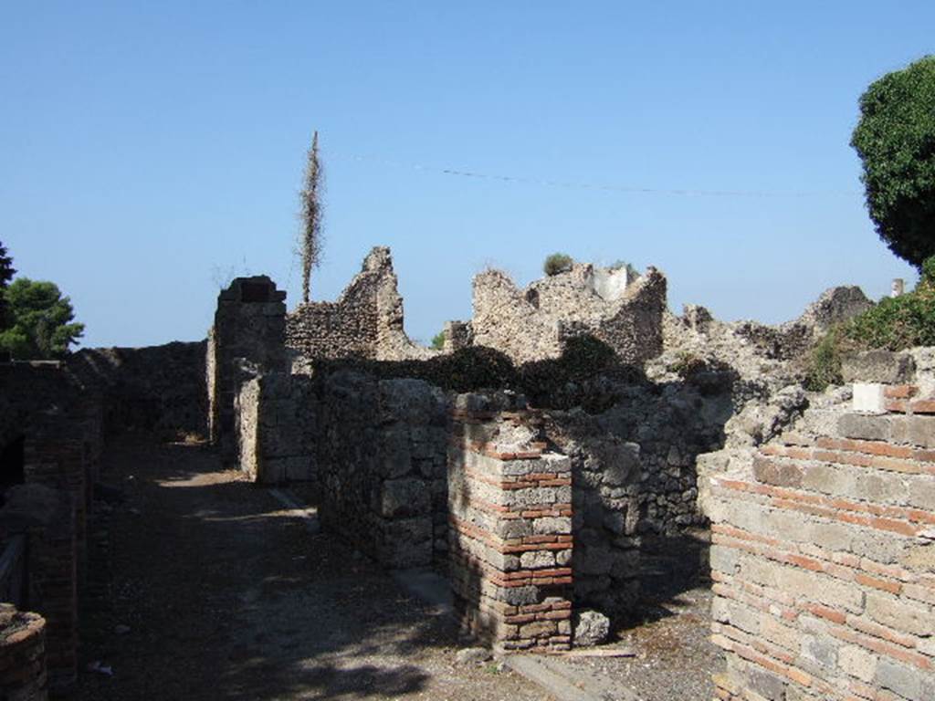 VII.16.1 Pompeii.  September 2005. Looking west towards doorways of VII.16.1-4 on Via Marina.