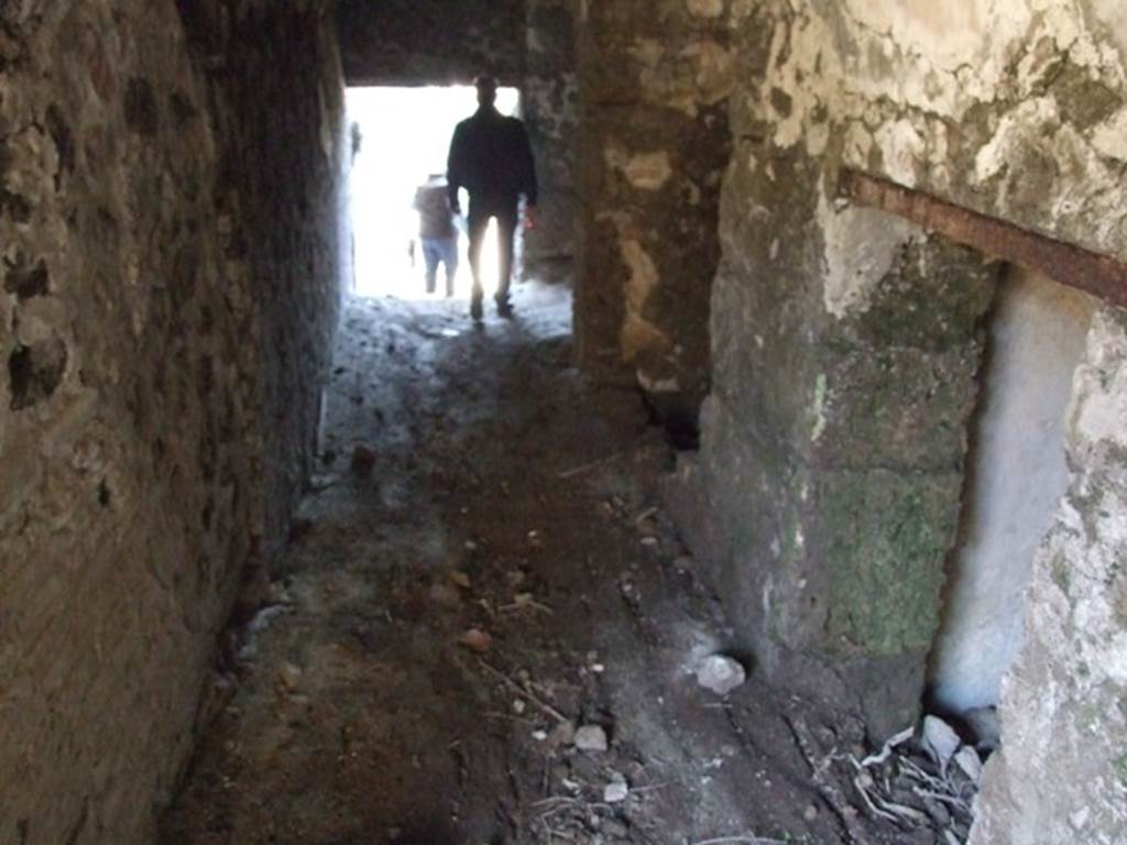 VII.16.13 Pompeii. March 2009. Looking west along corridor 40 to lower level. On the north side of the corridor can be seen doorways to small rooms, possibly storerooms (not photographed).