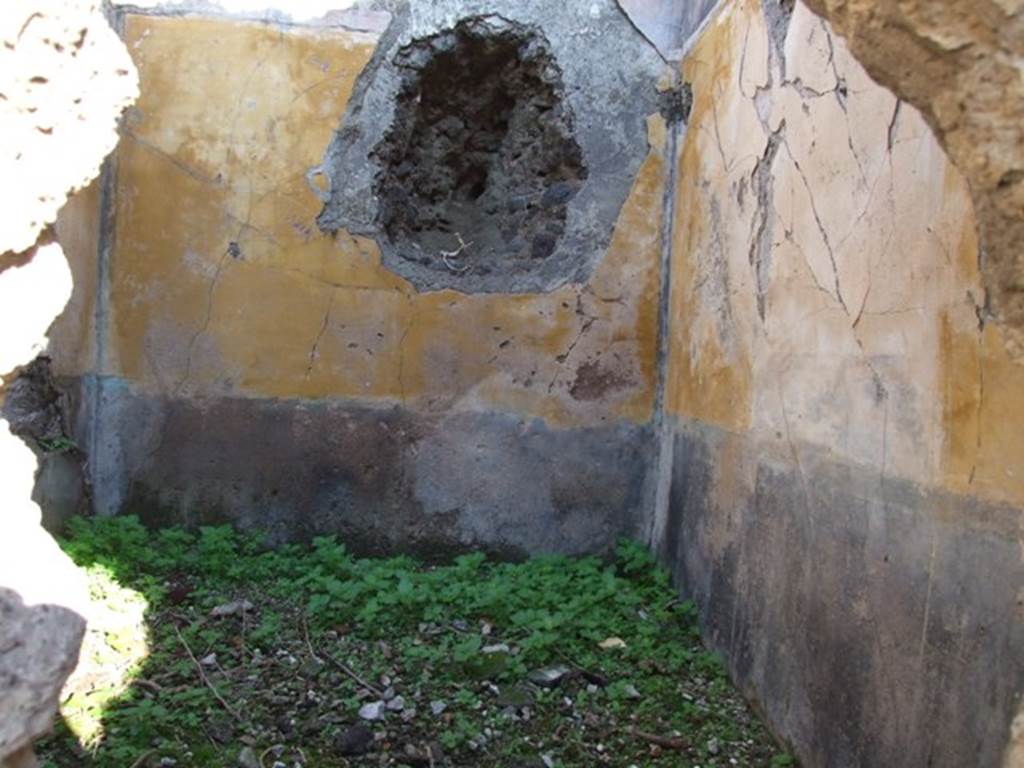 VII.16.13 Pompeii. December 2007. Looking through hole in rear wall of room 32 at incomplete hole in east wall of room 36.