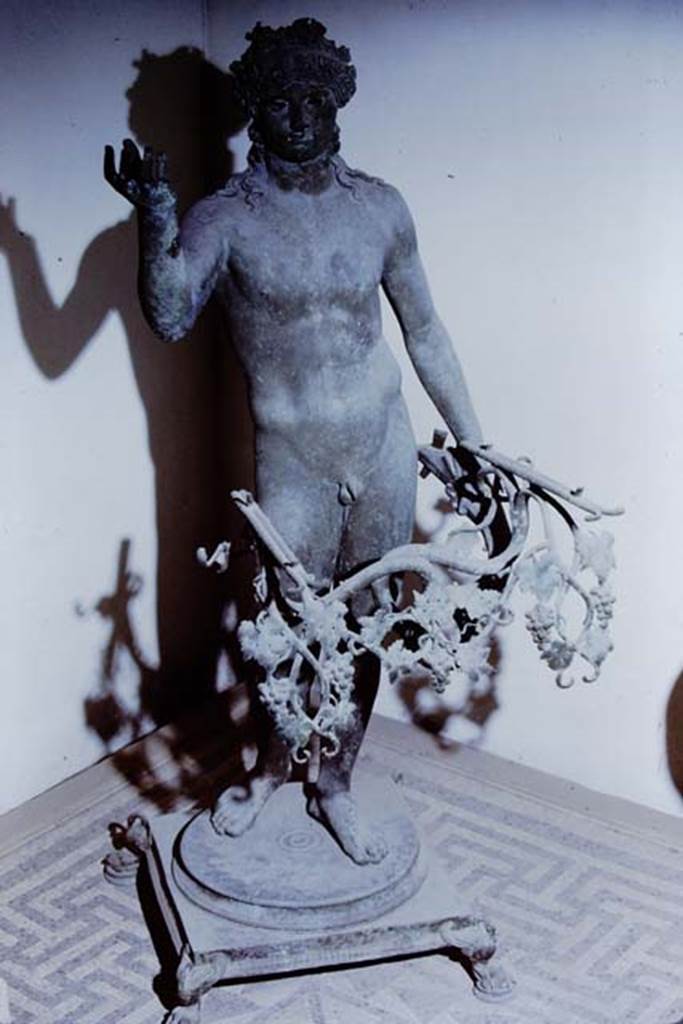 VII.16.22 Pompeii. 1971. Bronze lamp found in oecus.  Photo by Stanley A. Jashemski.
Source: The Wilhelmina and Stanley A. Jashemski archive in the University of Maryland Library, Special Collections (See collection page) and made available under the Creative Commons Attribution-Non Commercial License v.4. See Licence and use details.
J71f0159
