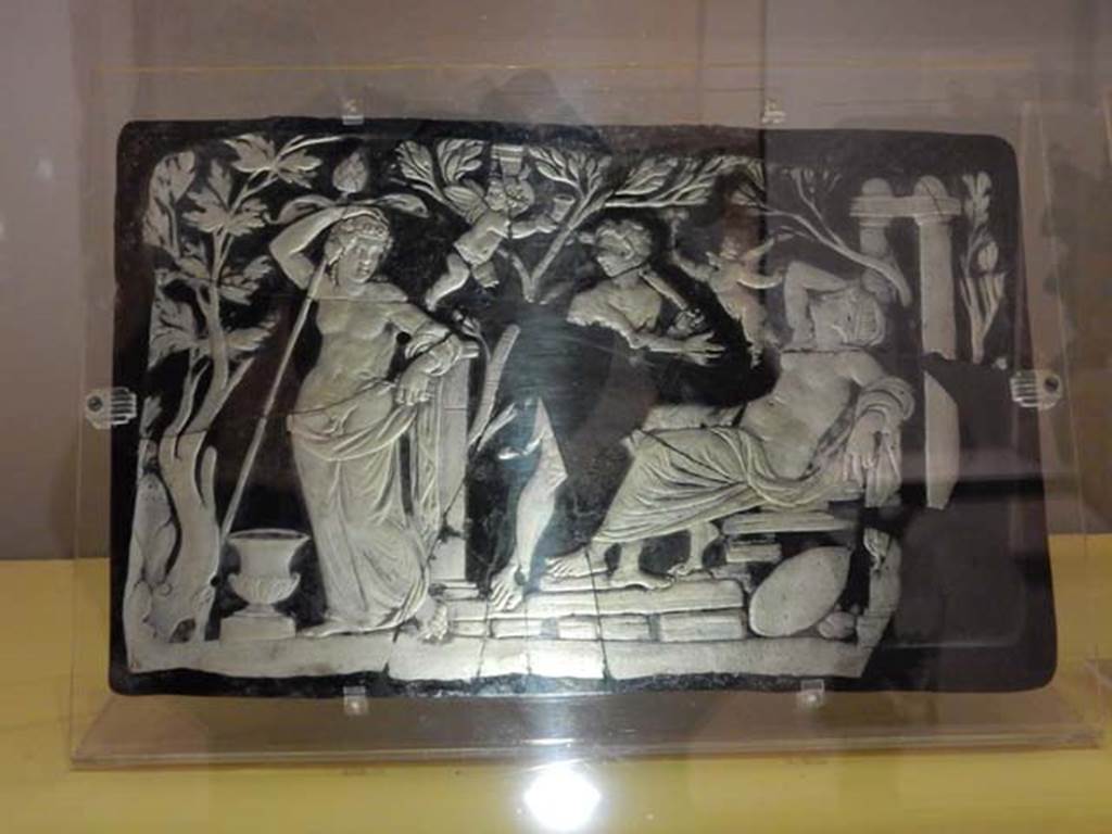 VII.16.17-22, Pompeii. May 2018. Found in the area outside the House of Fabius Rufus.
Cameo-glass panel, with the apparition of Dionysus to the sleeping Ariadne.
Archaeological Park of Pompeii, inv. nos. 153652. Photo courtesy of Buzz Ferebee.
