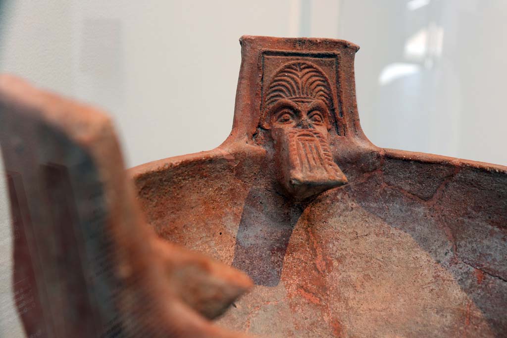 VIII.1.4 Pompeii. February 2021. 
Detail of terracotta brazier with the heads of Silenus, made in Asia Minor (western coast of Turkey).
Items dug out of the dump (scarico) on the west side of the Forum. Photo courtesy of Fabien Bièvre-Perrin (CC BY-NC-SA).
