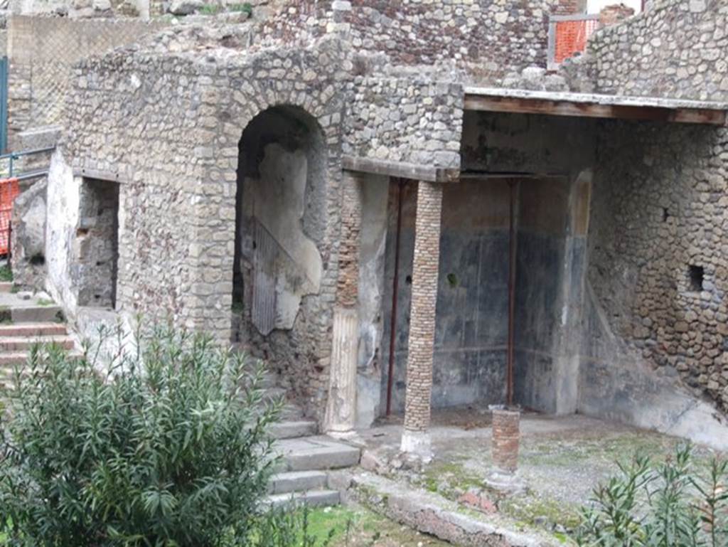 VIII.1.a Pompeii. December 2007. North end of portico. Painted plaster and steps from garden.