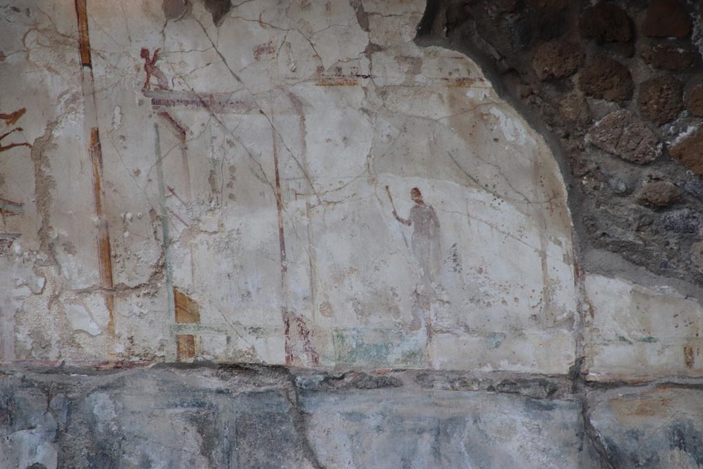 VIII.1.a Pompeii. October 2023. Detail of painted plaster on east wall at side of the portico. Photo courtesy of Klaus Heese.