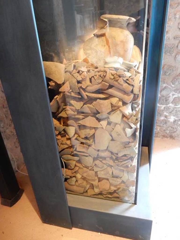 On display in Championnet complex Pompeii. May 2018. A well was rediscovered in one of the public buildings facing the Forum, and dated to the 2nd century BC, when the area was occupied by workshops. 
It was filled with containers for the transport of wine and fish sauces produced in the Italian peninsula, Africa and Spain.
Photo courtesy of Buzz Ferebee.

