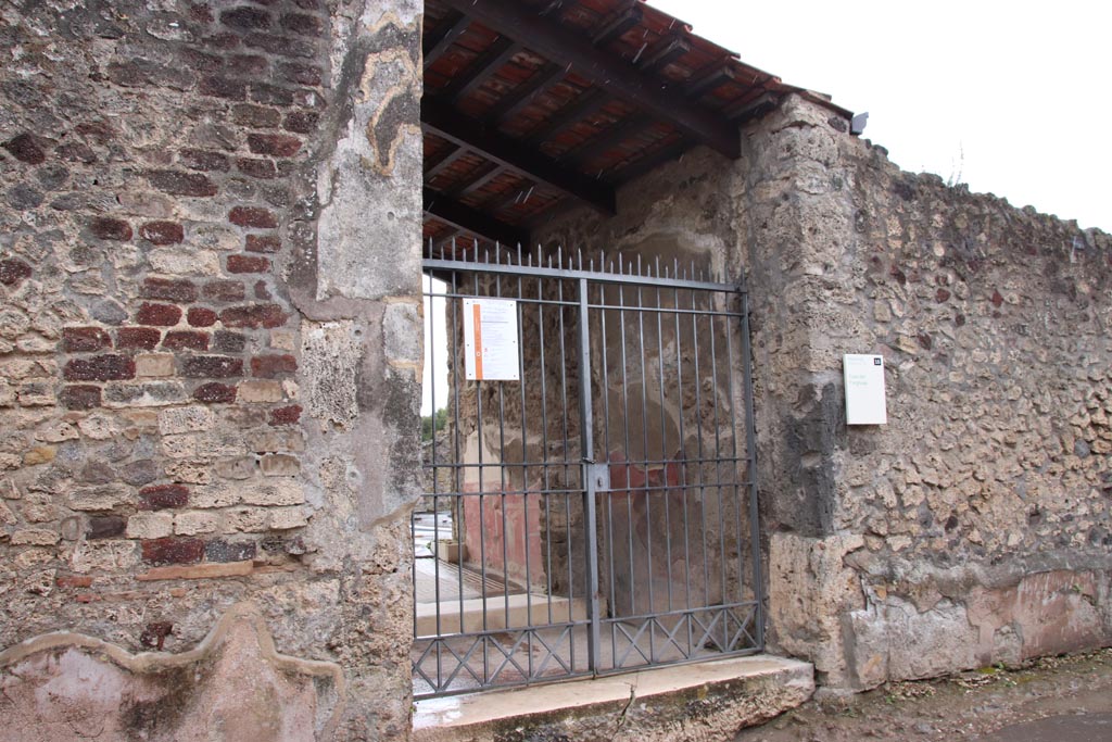 VIII.2.26 Pompeii. May 2024.  
Looking west along south side of Vicolo della Regina towards entrance doorway of VIII.2.26. Photo courtesy of Klaus Heese. 
