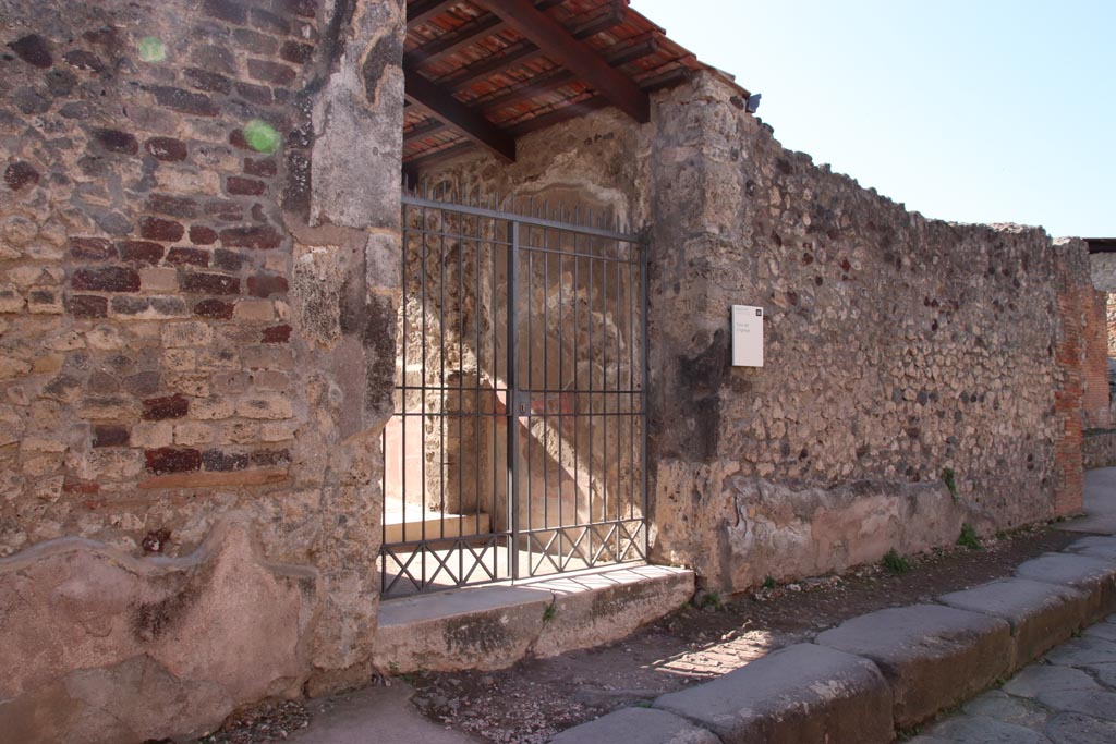 VIII.2.26 Pompeii. October 2022. 
Looking west along south side of Vicolo della Regina towards entrance doorway of VIII.2.26. Photo courtesy of Klaus Heese. 
