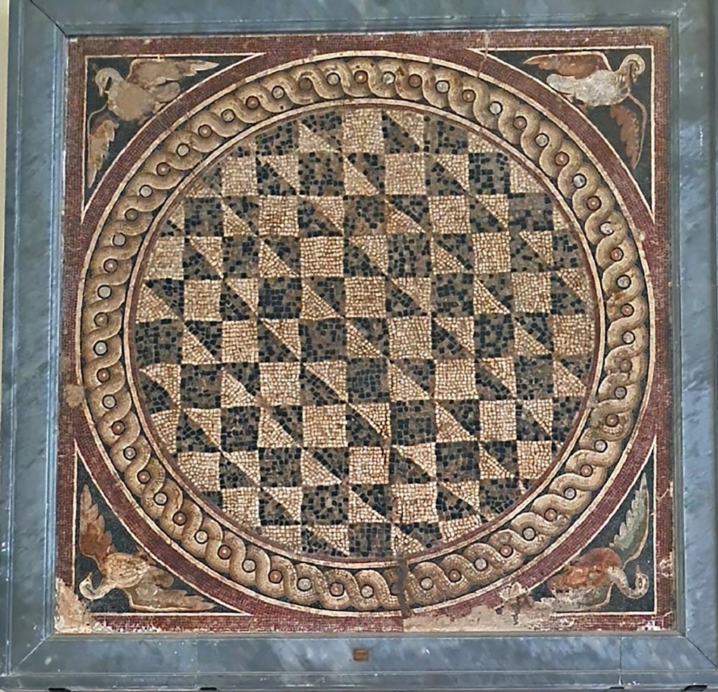 VIII.2.34 Pompeii. Room ‘m’, found in tablinum in February 1885. 
Mosaic with a circular pattern of squares and triangles and with a duck in each corner. 
Now in Naples Archaeological Museum.  Inventory number 114280. Photo courtesy of Giuseppe Ciaramella. September 2024.
See Notizie degli Scavi di Antichità, 1885, p. 49.  
