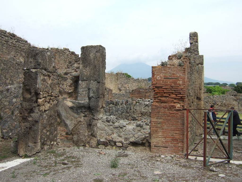 VIII.2.34 Pompeii. May 2006. Room in north-west corner of atrium. According to NdS, the kitchen was entered through the first doorway on the west side of the atrium. As well as the hearth and latrine, the kitchen also contained another rustic room that at one time was linked to the atrium. The posticum at VIII.2.33 was also near the kitchen. See Notizie degli Scavi, April 1885, (p.163)