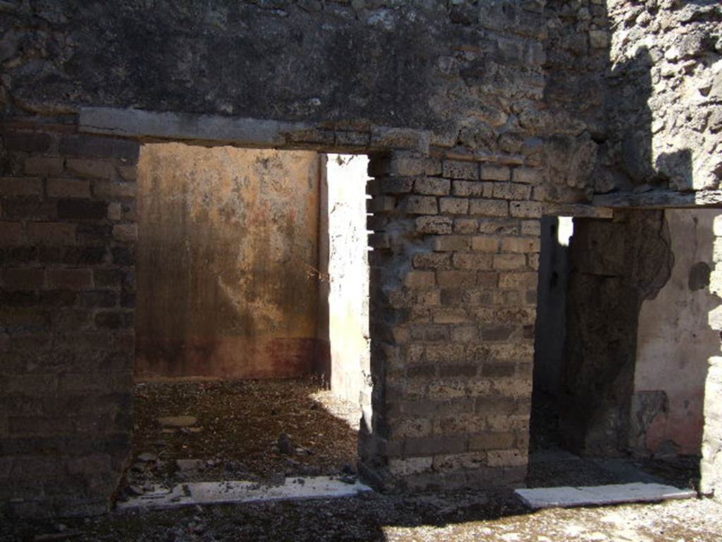 VIII.3.12 Pompeii. September 2005. 
Looking west from entrance across yard/courtyard towards oecus, and corridor (part of triclinium) leading to VIII.3.11.

