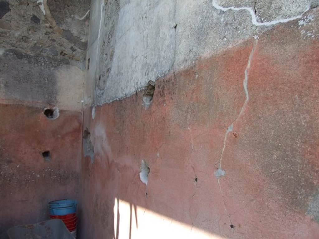 VIII.4.4 Pompeii. March 2009. Room 21, north-west corner of ala or cupboard.   Shelving support holes in west and north walls.
