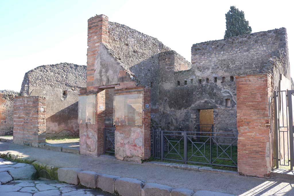 VIII.4.7, VIII.4.6, and VIII.4.5 Pompeii, right of centre. December 2018. 
Looking to entrance doorways on south side of Via dell�Abbondanza. Photo courtesy of Aude Durand.

