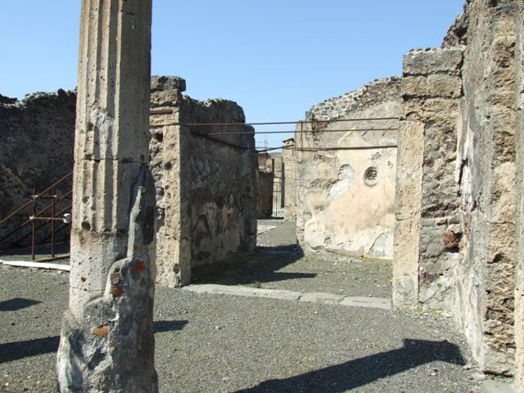 VIII.4.15 Pompeii. March 2009. Room 5, oecus.  Looking north towards the north-east corner of the portico, the oecus, and the small doorway into the atrium. According to Fiorelli, when excavated this oecus had two paintings on its walls.  He thought one was Paris and Oenone. 
The other representing two bearded men talking together and accompanying their words with gestures.  Helbig wrote, this room had paintings of Paris and Oenone (1280) and the other was unclear (1398).
See Helbig, W., 1868. Wandgem�lde der vom Vesuv versch�tteten St�dte Campaniens. Leipzig: Breitkopf und H�rtel.
See Pappalardo, U., 2001. La Descrizione di Pompei per Giuseppe Fiorelli (1875). Napoli: Massa Editore. (p.129)


