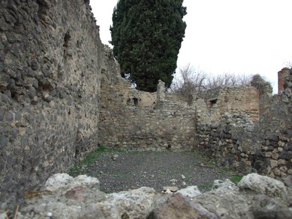 VIII.4.34 Pompeii. December 2007. Workshop room on west side of atrium, looking north.
According to Eschebach, at the rear of the workshop was the kitchen and latrine, and steps to the upper floor of which 15 steps were remaining. Underneath the steps was a cupboard/small room.
See Eschebach, L., 1993. Geb�udeverzeichnis und Stadtplan der antiken Stadt Pompeji. K�ln: B�hlau, (p.376).
According to Bragantini, et al, against the west wall of the kitchen stood the masonry bench/podium with storage below. At the side of the bench was a wall, separating the bench from the latrine.
See Bragantini, de Vos, Badoni, 1986. Pitture e Pavimenti di Pompei, Parte 3. Rome: ICCD, (p.345).
