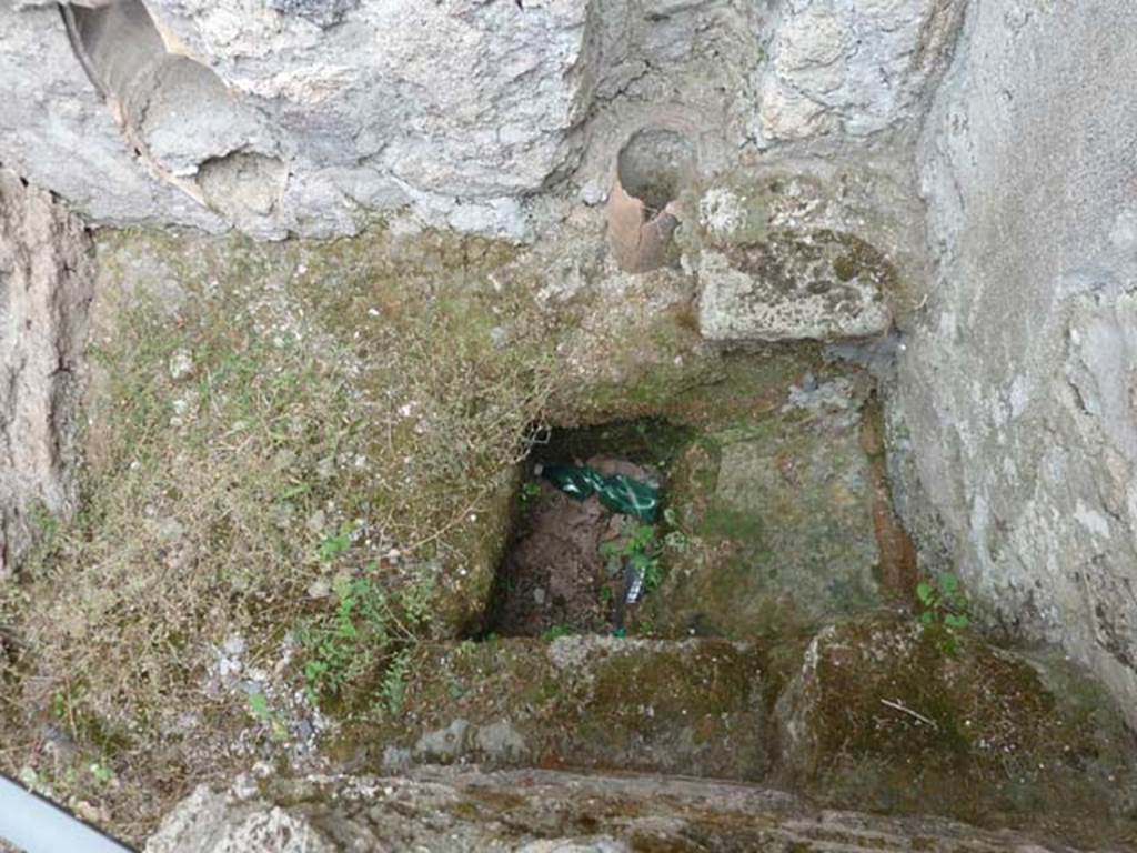 VIII.4.37 Pompeii. September 2015. Latrine, with remains of terracotta pipe from upper floor.
According to Hobson, this was a latrine with two down pipes and an upper storey latrine.
See Hobson, B. 2009. Pompeii, Latrines and Down Pipes. Oxford, Hadrian Books, p. 448.
See Eschebach, L., 1993. Geb�udeverzeichnis und Stadtplan der antiken Stadt Pompeji. K�ln: B�hlau. (p.376-7)
