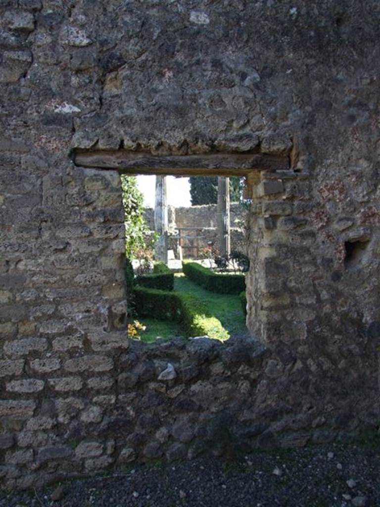 VIII.5.28 Pompeii. March 2009. Room 12, Oecus. East wall, with window overlooking Garden area.