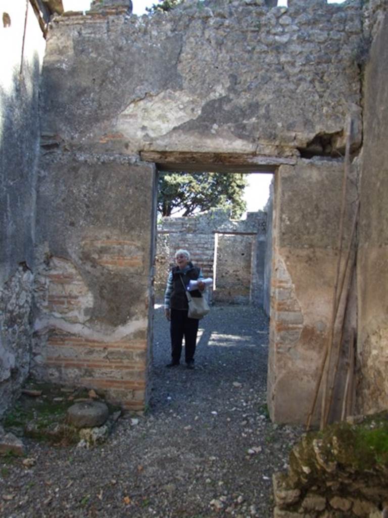 VIII.5.37 Pompeii. March 2009. Room 15, east wall of kitchen, with doorway to room 1, the atrium.