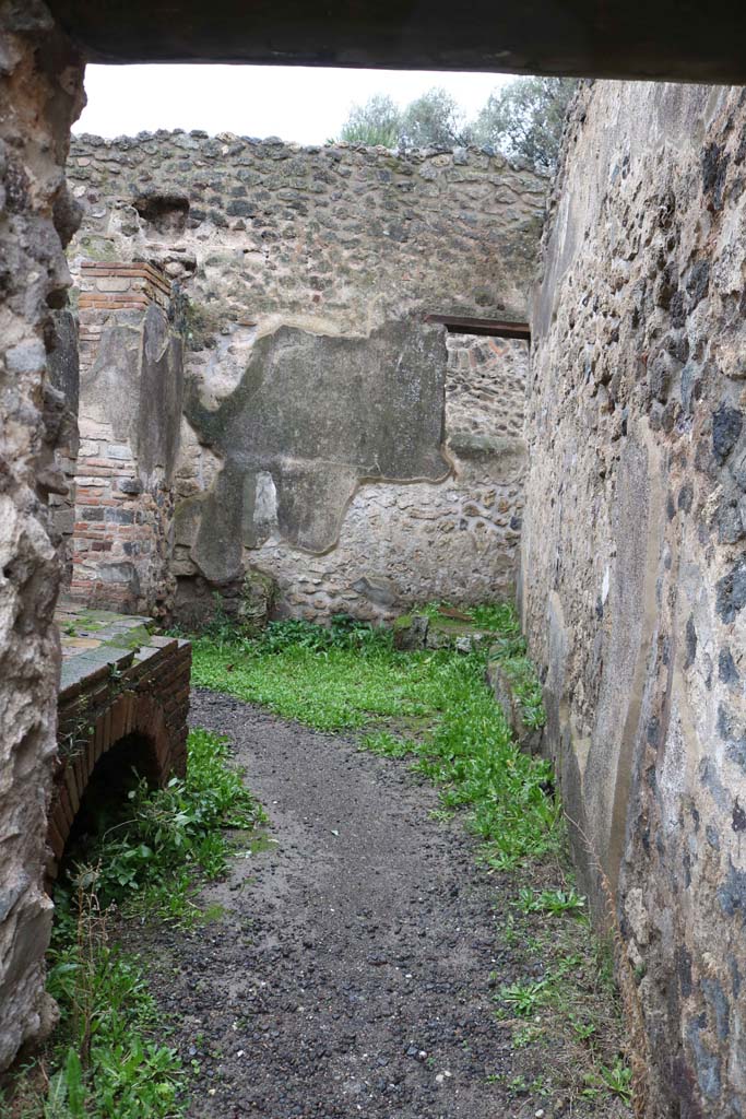 VIII.6.11, Pompeii. December 2018. 
Looking west through doorway into kitchen. Photo courtesy of Aude Durand.
