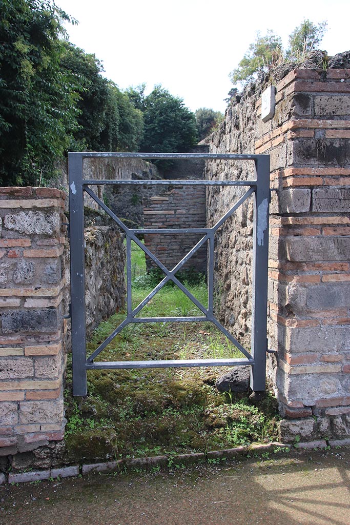 VIII.7.2 Pompeii. October 2024. 
Looking west towards entrance to steps to upper floor. Photo courtesy of Klaus Heese.
