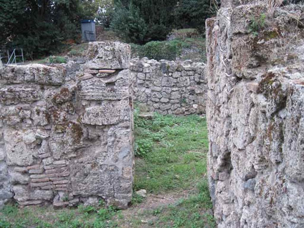 VIII.7.6 Pompeii. September 2010.  Looking south towards doorway to “rustic” room in north-west corner of atrium. Photo courtesy of Drew Baker.

