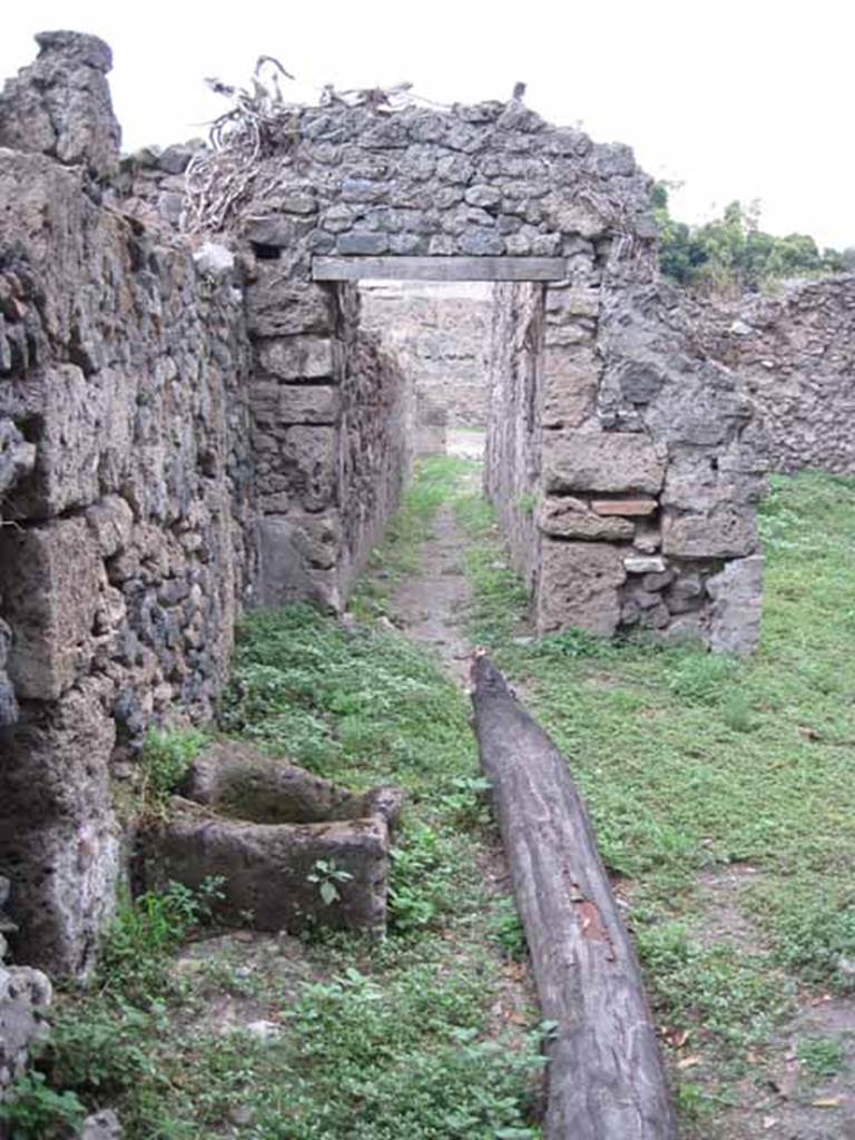 VIII.7.6 Pompeii. September 2010.  Main corridor, looking east towards road from portico area. Photo courtesy of Drew Baker.
