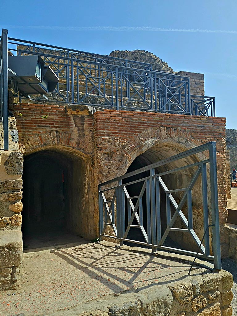 VIII.7.20 Pompeii. September 2024. 
Looking east towards arch with tribunal above it. Photo courtesy of Giuseppe Ciaramella.
