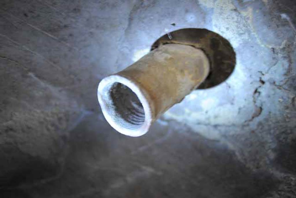 VIII.7.22/23/24 Pompeii. October 2010. Details of terracotta pipe in ceiling of room E, looking west. Photo and information courtesy of Drew Baker/Gareth Beale/Hembo Pagi.