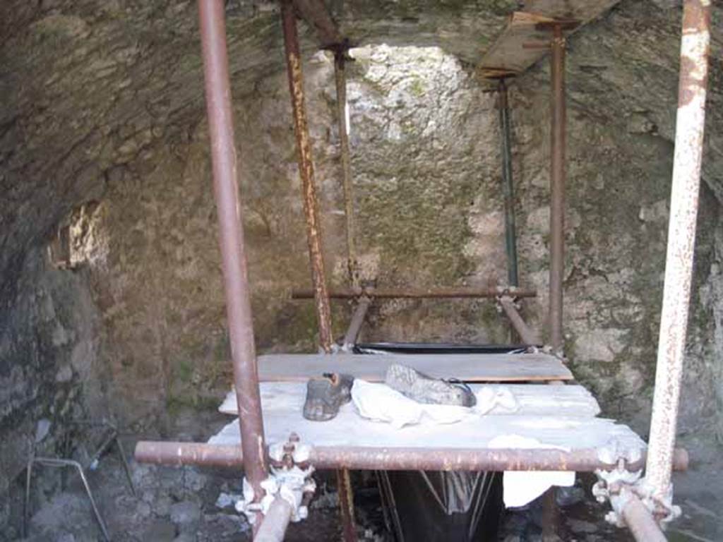 VIII.7.24 Pompeii. September 2010. Looking south into “storage room” on south side of atrium. In the south-east corner can be seen the blocked doorway from the small room or latrine in VIII.7.23. Photo courtesy of Drew Baker.