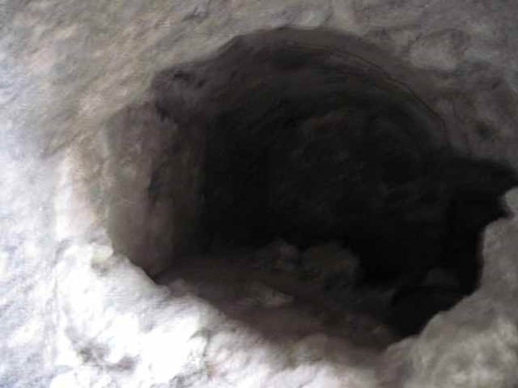 VIII.7.24 Pompeii. October 2010. West wall (south-west corner) of “storage room” on south side of atrium. A vaulted room, half filled with debris, leading west off of "storage room". This would be under the stairs to upper part of the house. Photo and information courtesy of Drew Baker/Gareth Beale/Hembo Pagi