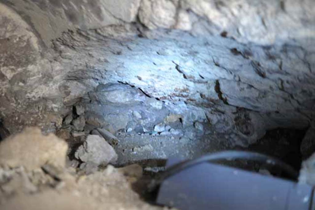 VIII.7.24 Pompeii. October 2010. North-west side of vaulted room, half filled with debris, leading west off of "storage room". There does seem to have a recess in the north wall. Photo and information courtesy of Drew Baker/Gareth Beale/Hembo Pagi.