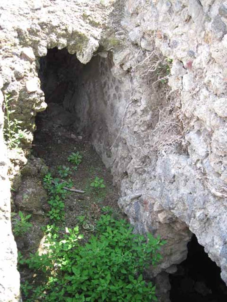 VIII.7.24 Pompeii. September 2010. Detail of excavation in photo above, looking down and south along corridor towards posticum at VII.7.22. Photo courtesy of Drew Baker.


