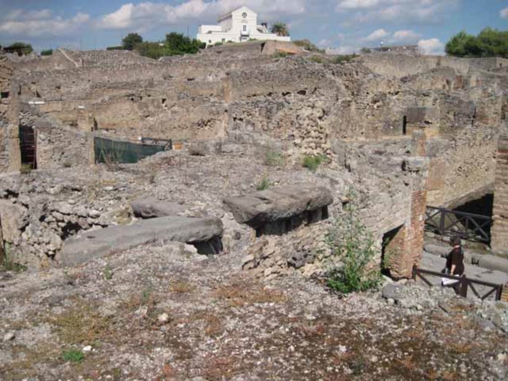 VIII.7.24 Pompeii. September 2010. Looking north-east across northern portico of garden, towards Via Stabiana and Casina dell�Aquila, on the skyline. Photo courtesy of Drew Baker.
