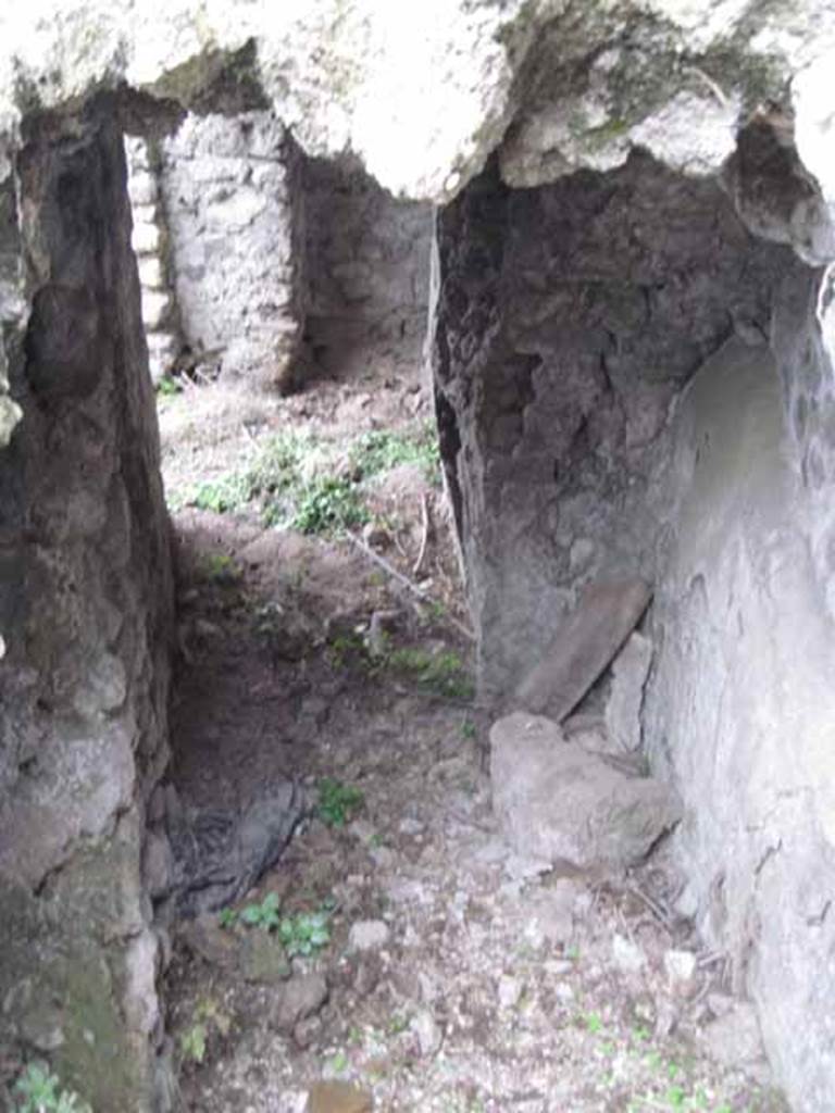 VIII.7.22/23/24 Pompeii. October 2010. Looking south along corridor A, towards access from the rear of VIII.7.23/22. Photo and information courtesy of Drew Baker/Gareth Beale/Hembo Pagi.
